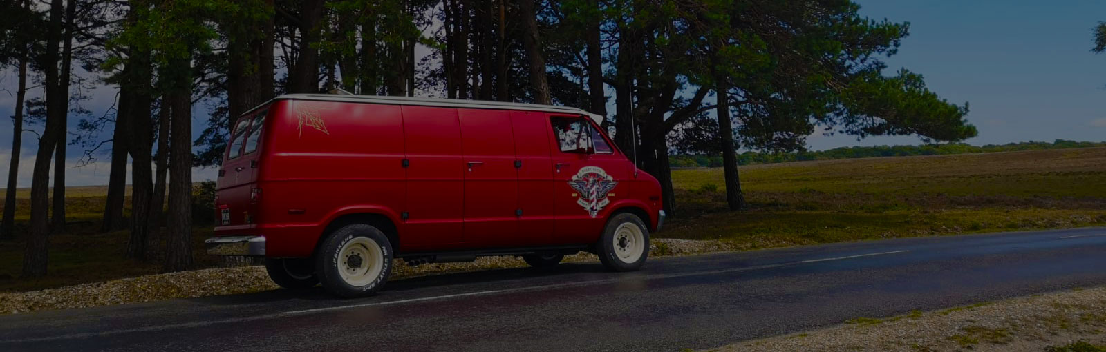 Red Camper Van With Side Door Crest In Hampshire